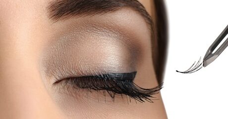 Stylists apply individual semi-permanent extensions to natural lashes to create a fuller